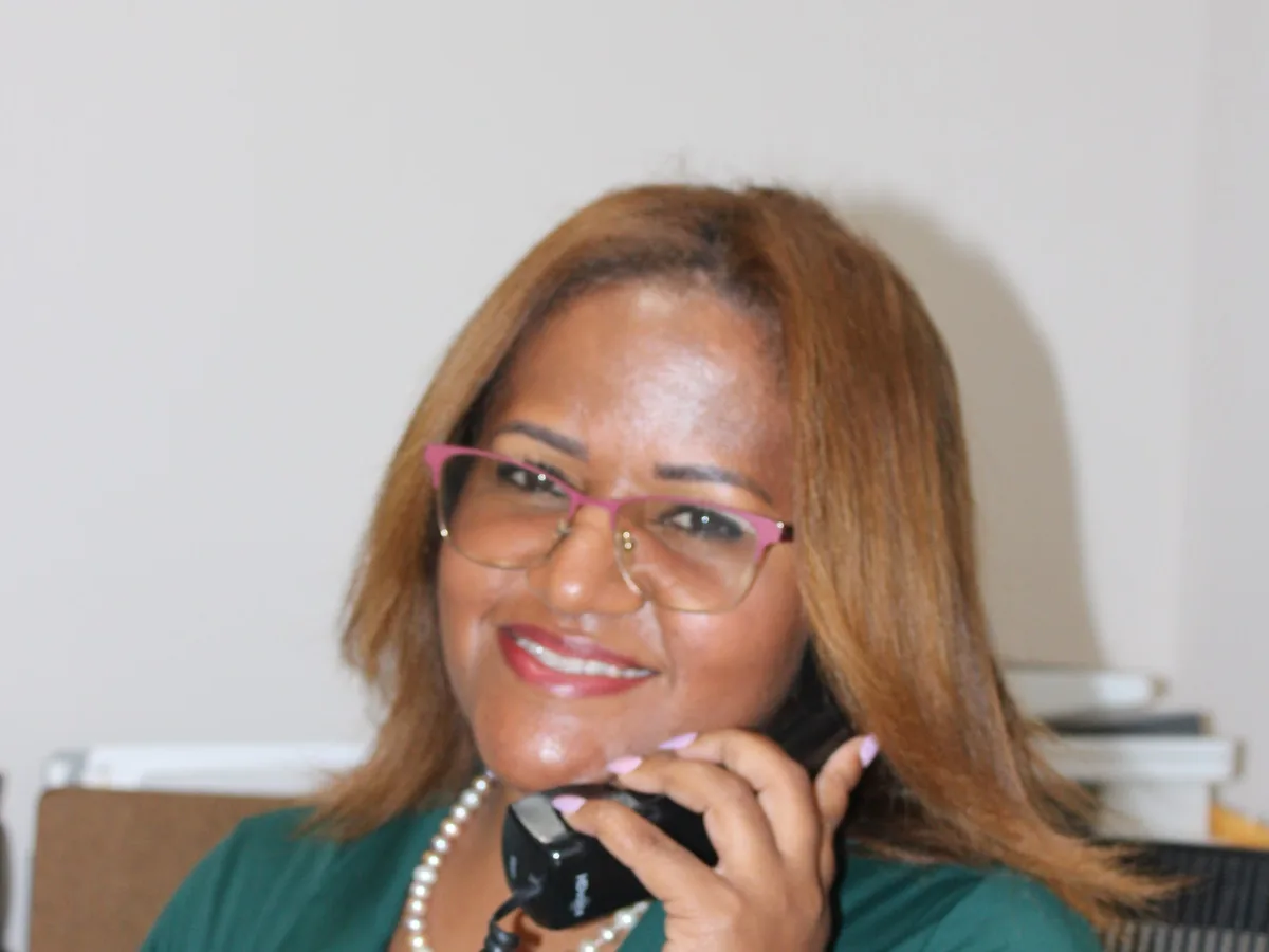 Evelyn Mateo, Melgar Law Firm team, taking a call